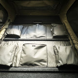 Rooftop tent organiser pouches fitted inside the roof of an AX27 clamshell tent