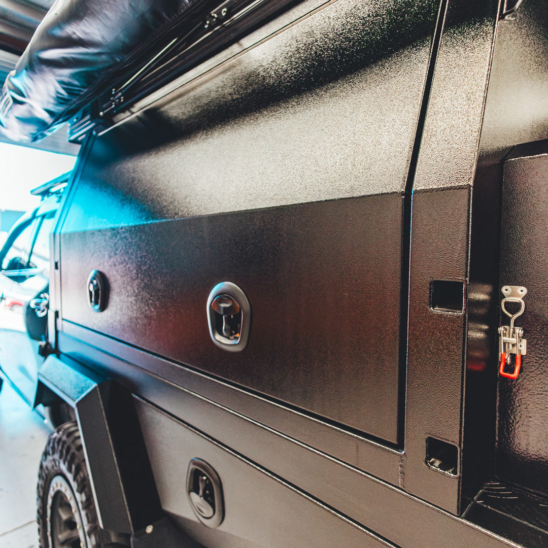 Close-up of a vehicle's storage compartment with a visible brand logo.